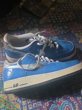 Blue Low-Top Sneakers with Silver Swoosh